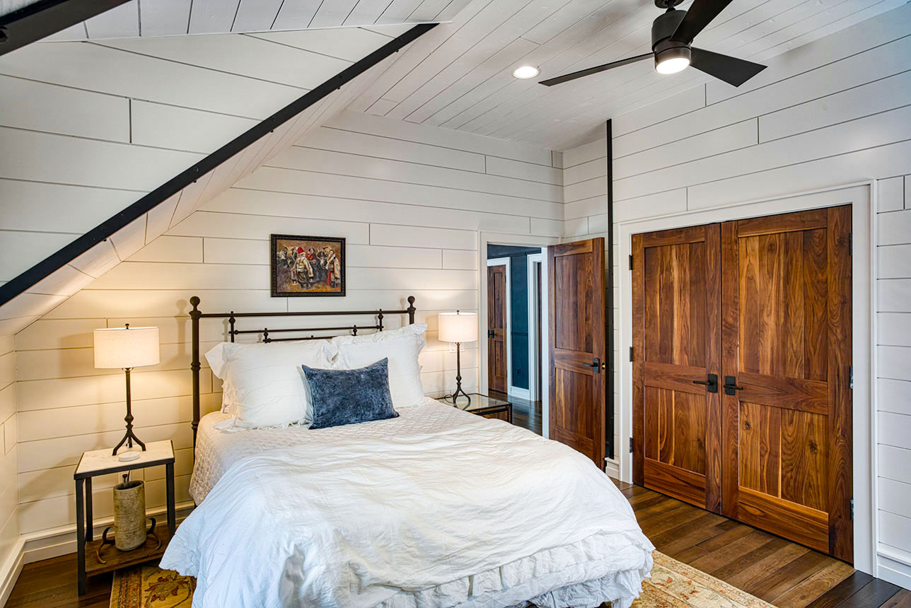Lakeside bedroom with vaulted ceiling